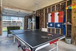 Fun garage area with ping-pong table, cornhole and an additional fridge